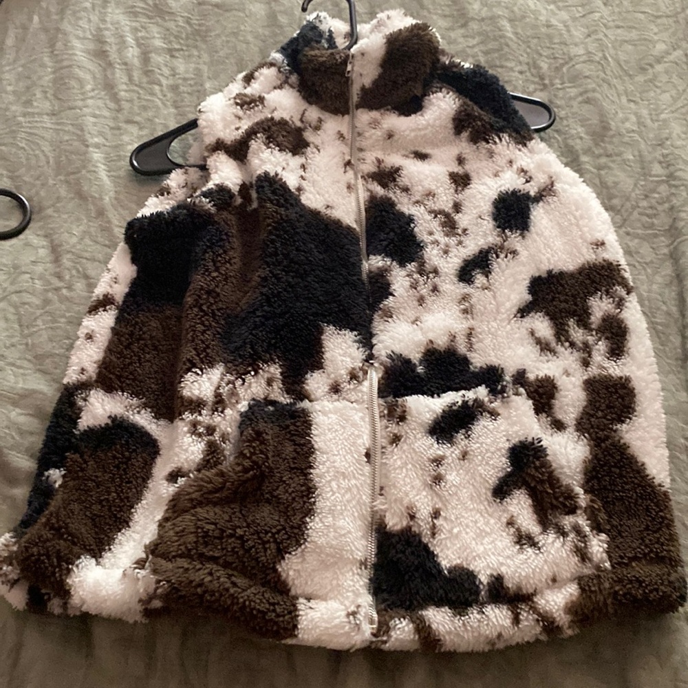 Cow print vest size small. Unknown brand